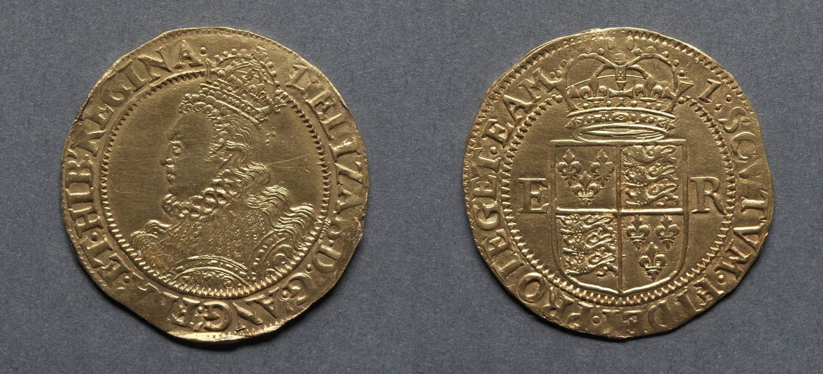 Two faces of a gold coin are reproduced together. A crowned portrait occupies one; a crowned, quartered shield and surrounding letters occupy the other.