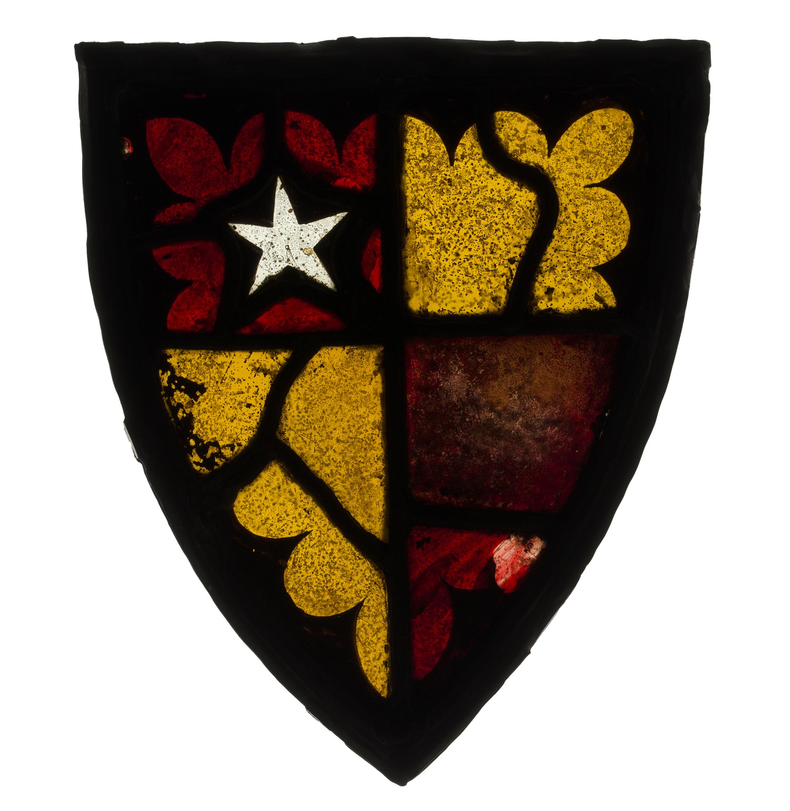 A shield-shaped stained-glass panel with red and yellow areas, a pale five-pointed star at upper left, and dark structural lines and irregular joins.